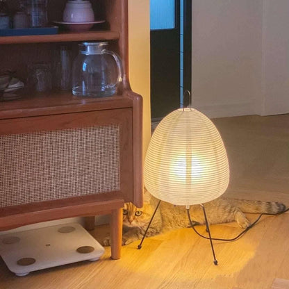 Side profile showcasing the ovate silhouette of the table lamp