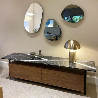 Scale reference for the brass table lamp on a bedside table