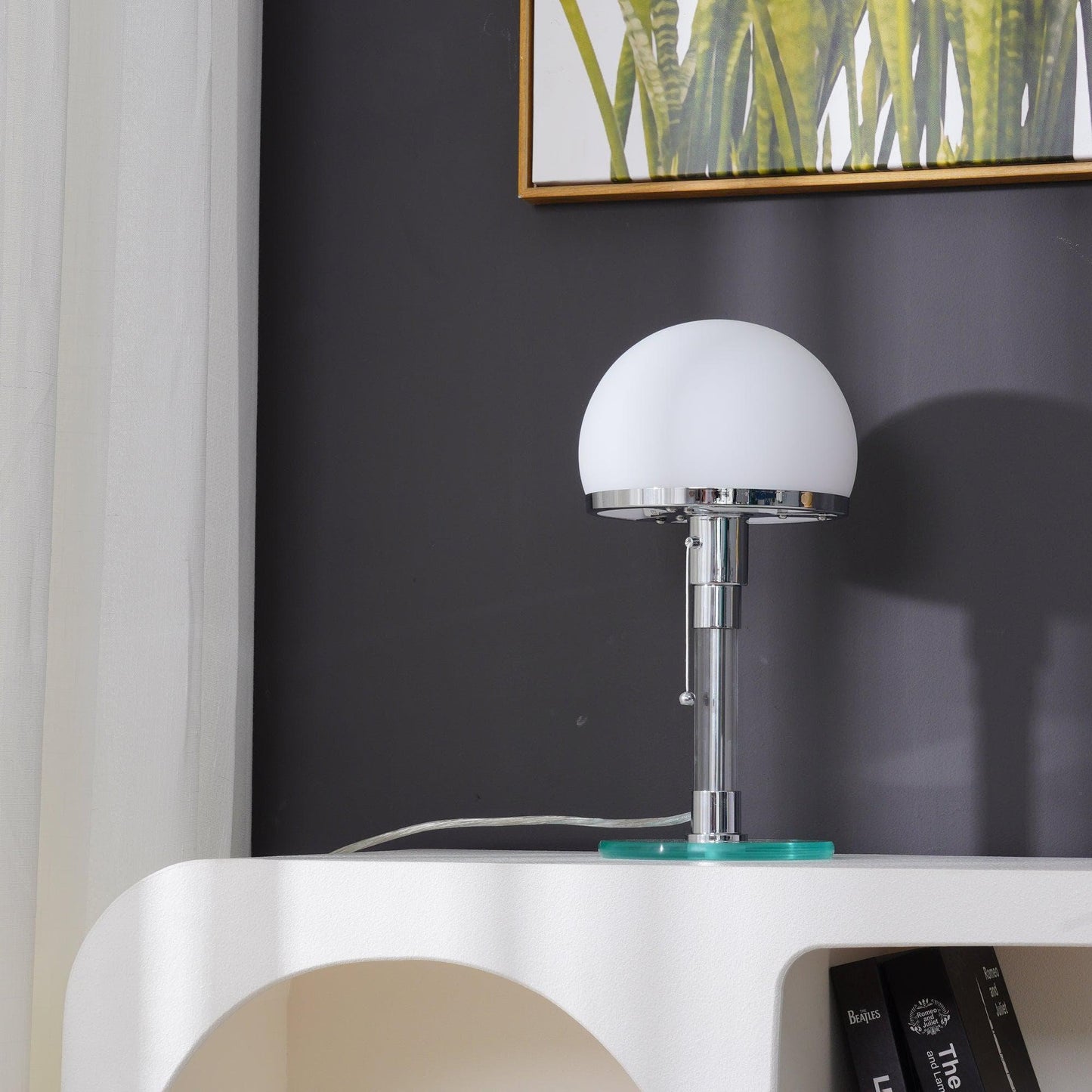 Geometric silhouette of the glass dome table lamp with a circular glass base