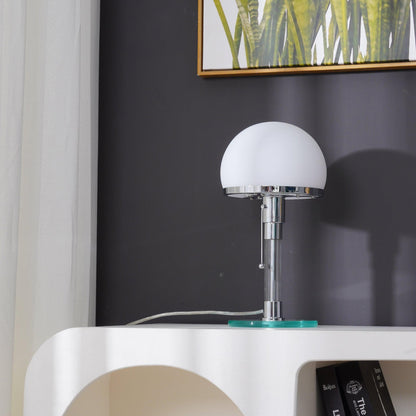 Geometric silhouette of the glass dome table lamp with a circular glass base