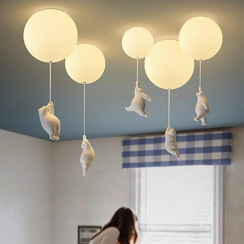 Close-up of white sculpted bear detail on acrylic globe light