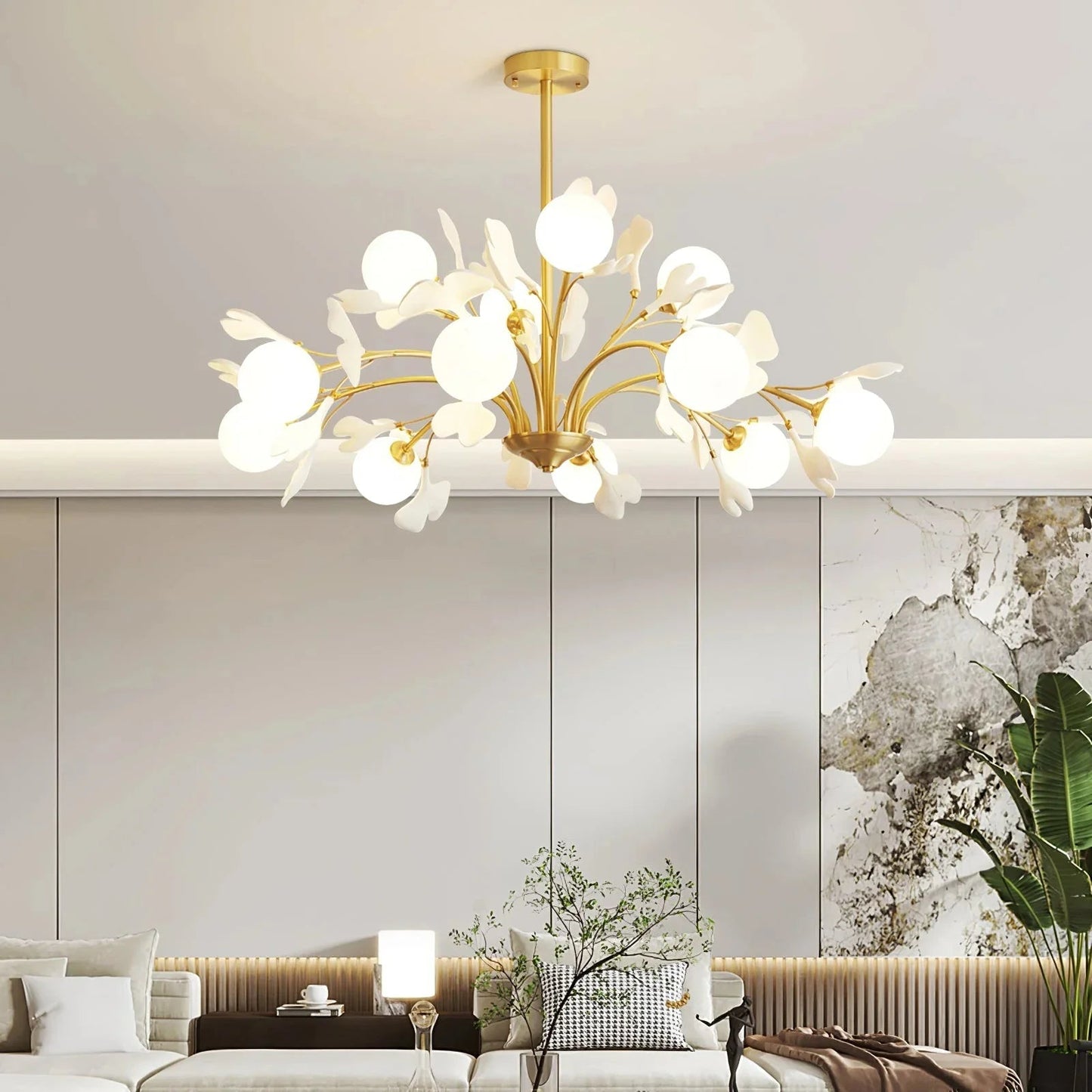 Close-up of delicate white ceramic leaves on a brass chandelier