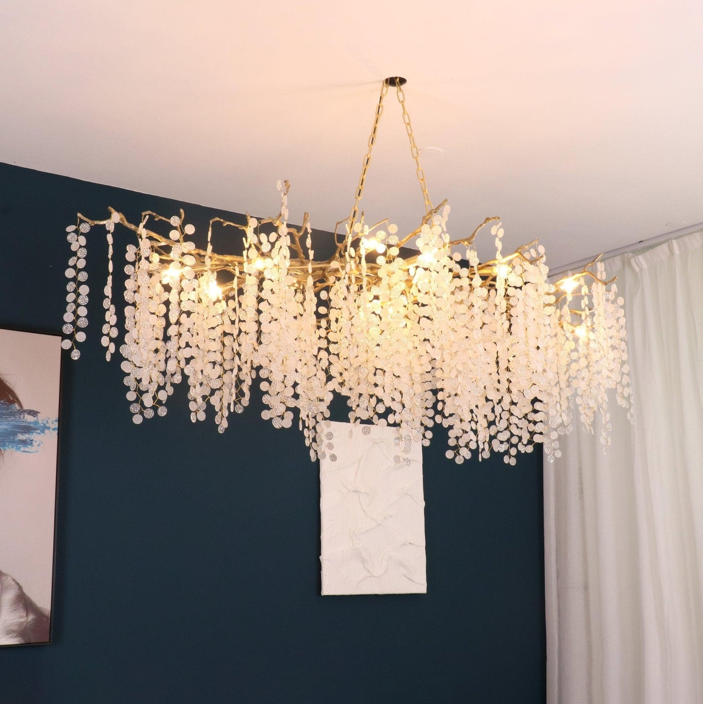 Ethereal chandelier casting a warm glow in a luxurious living room