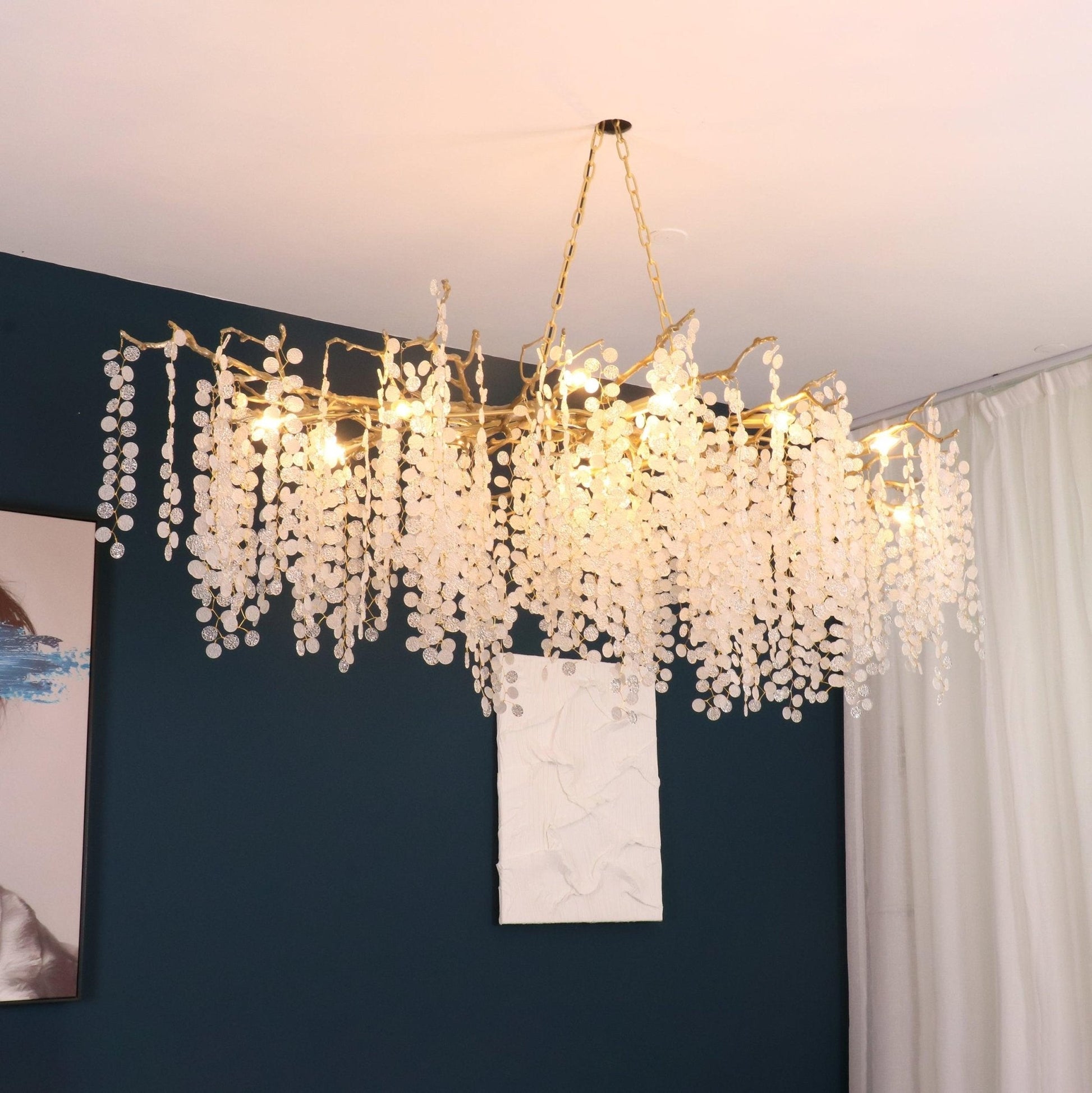 Ethereal chandelier casting a warm glow in a luxurious living room