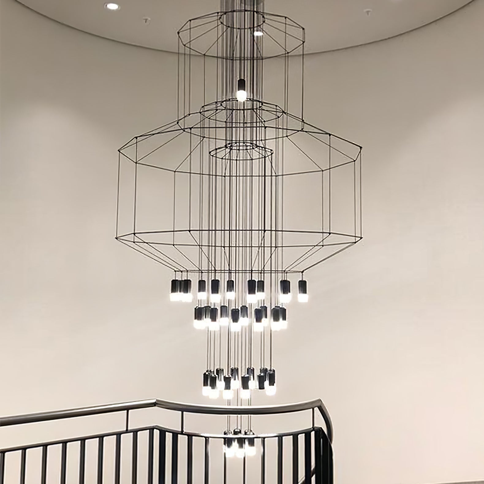 Installation view of the geometric wire frame chandelier scale