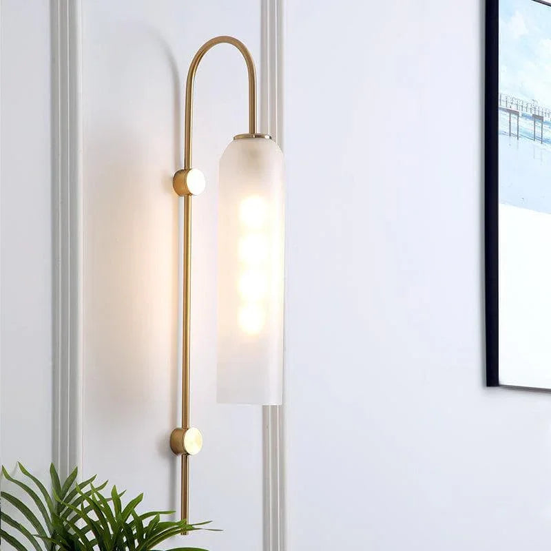 Modern living room ambiance with a glowing teal glass wall sconce from Lumotrot