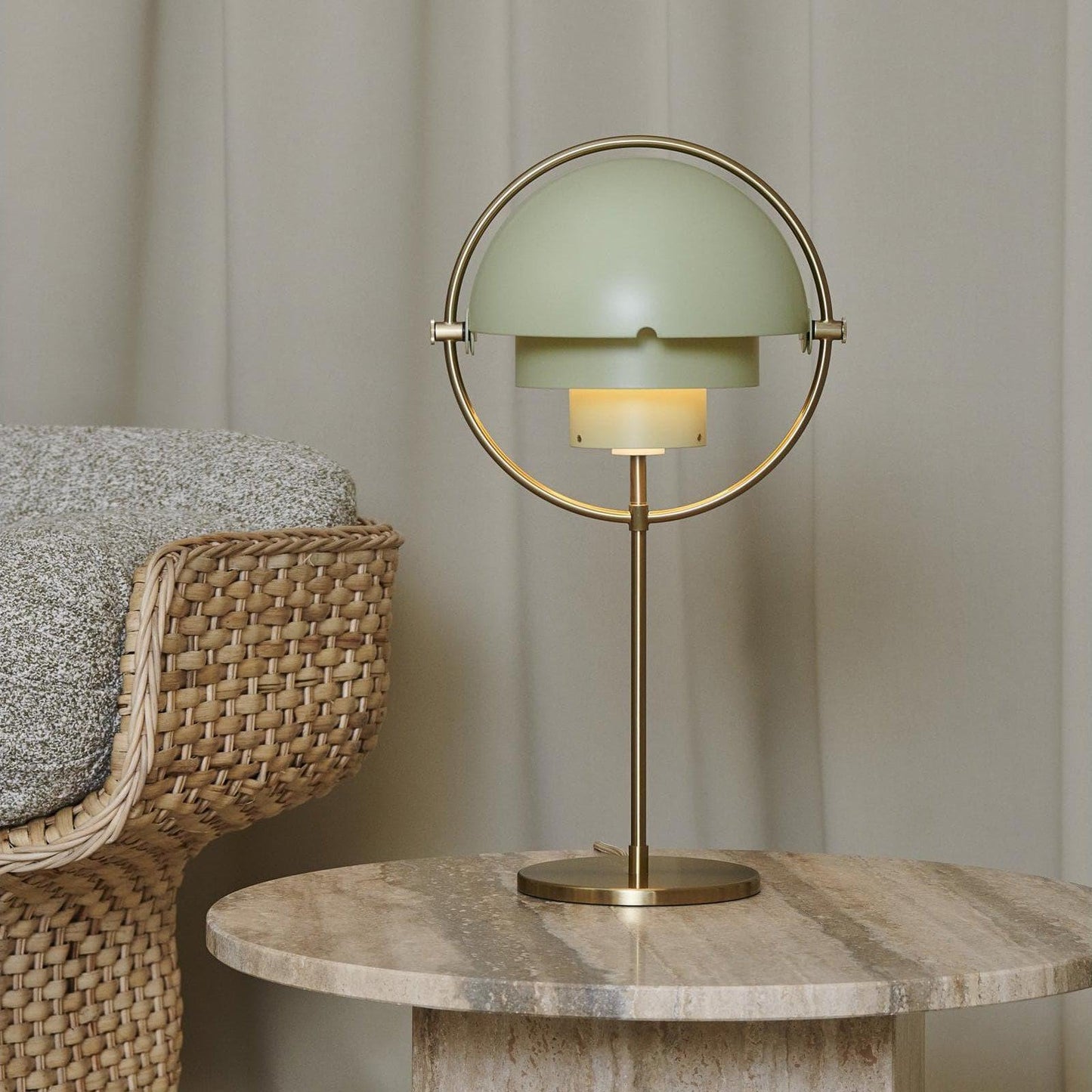 Ambient light created by the brass table lamp in a stylish living room setting