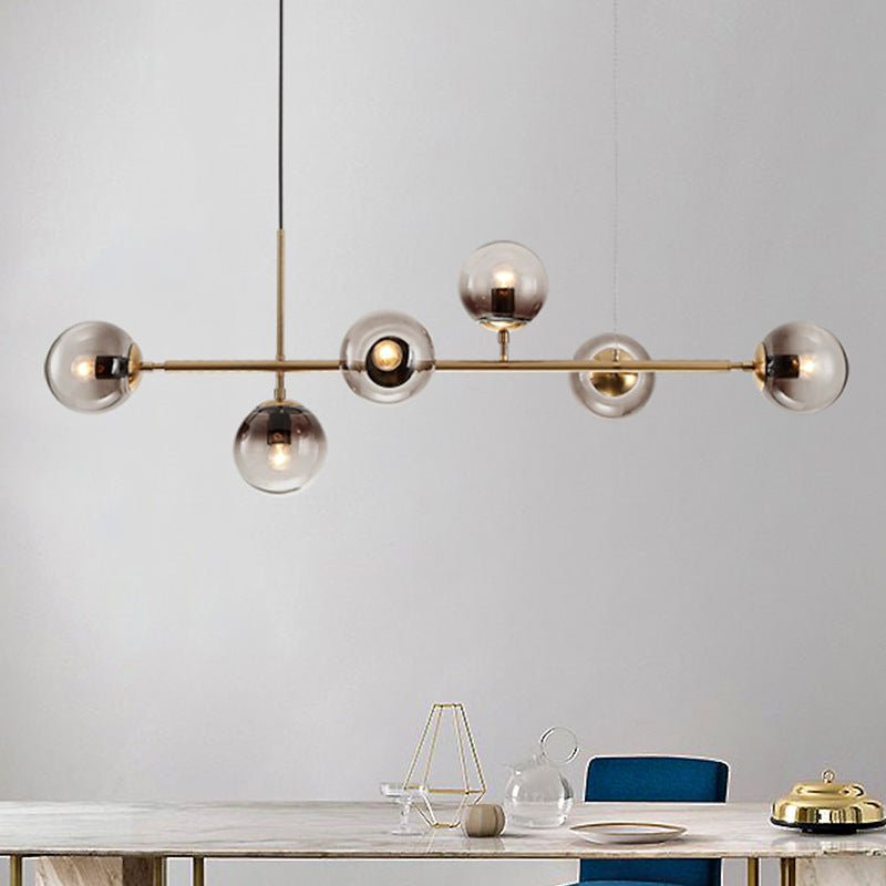 Modern living room ambiance enhanced by a brass glass orb chandelier