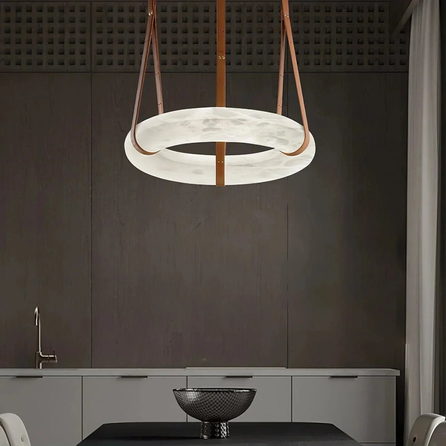 Living room illuminated by the soft glow of the Oslo Alabaster Pendant Light