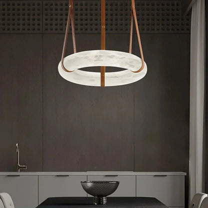 Living room illuminated by the soft glow of the Oslo Alabaster Pendant Light
