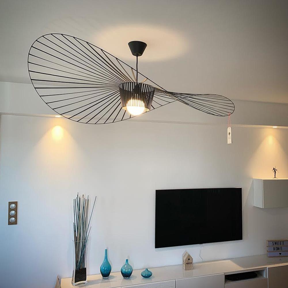 Modern living room featuring a large organic pendant light creating soft ambiance