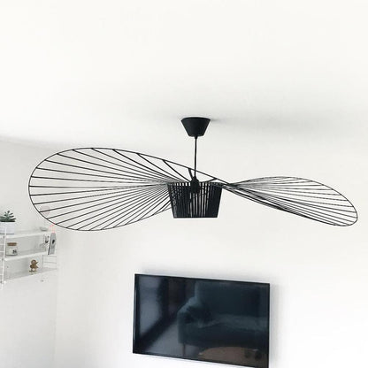 Pendant light suspended from ceiling, showing adjustable cord and scale