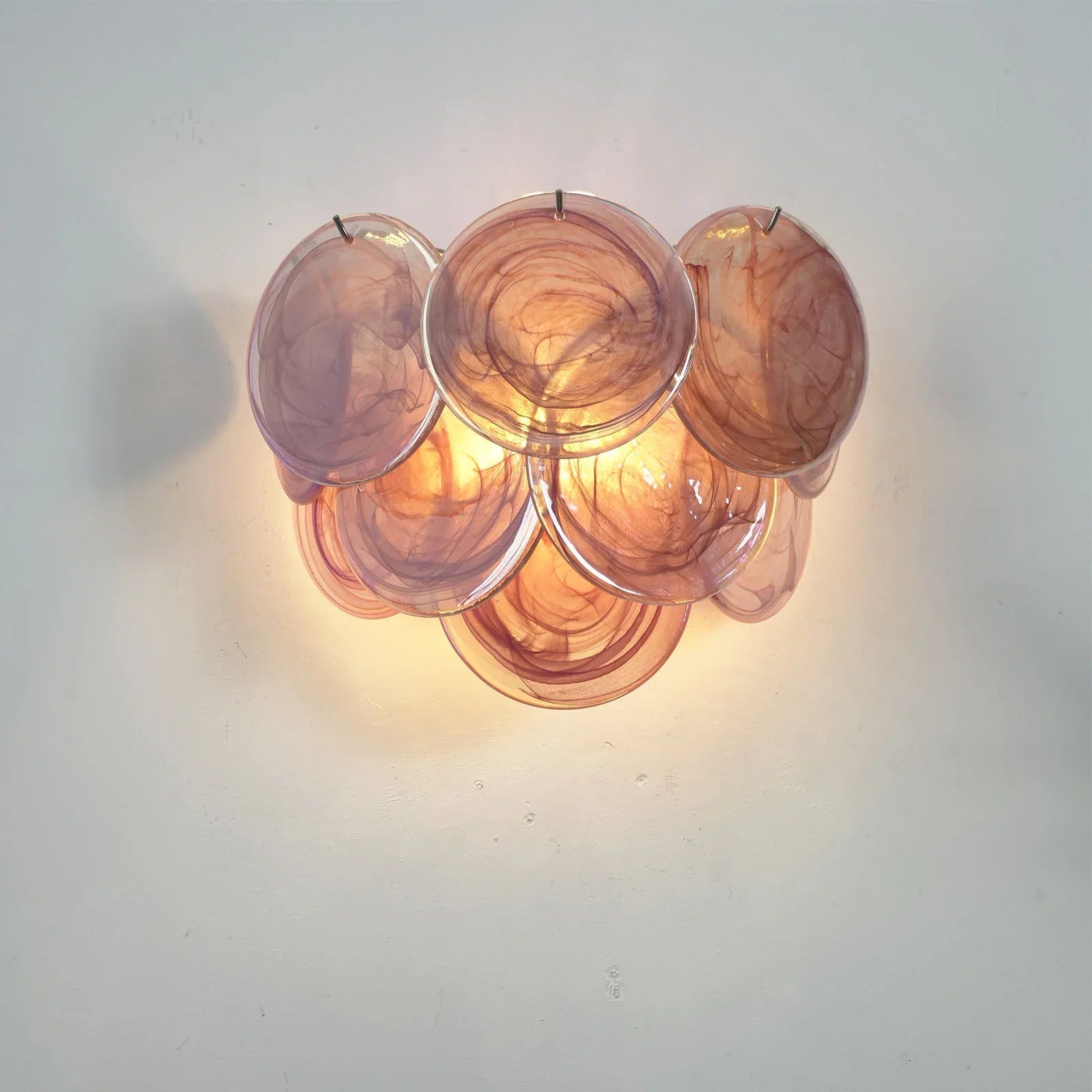 Organic silhouette of rose glass wall sconce from the side