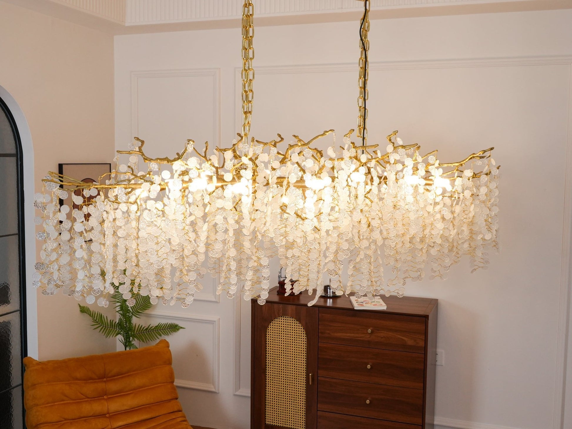 Detailed view of chandelier chain and canopy for scale and installation