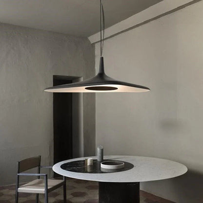 Close-up of the matte black metal finish on the disc pendant light