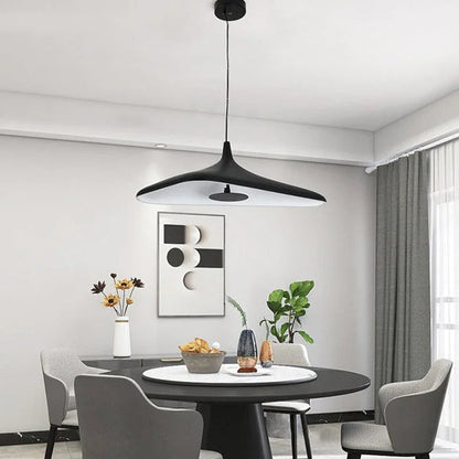 Profile view of the sleek, thin disc silhouette pendant light