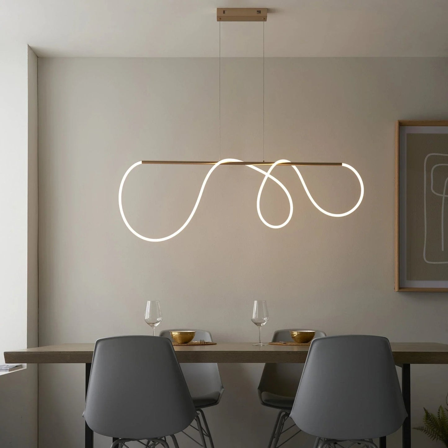 Polished brass hardware detail on sculptural pendant light