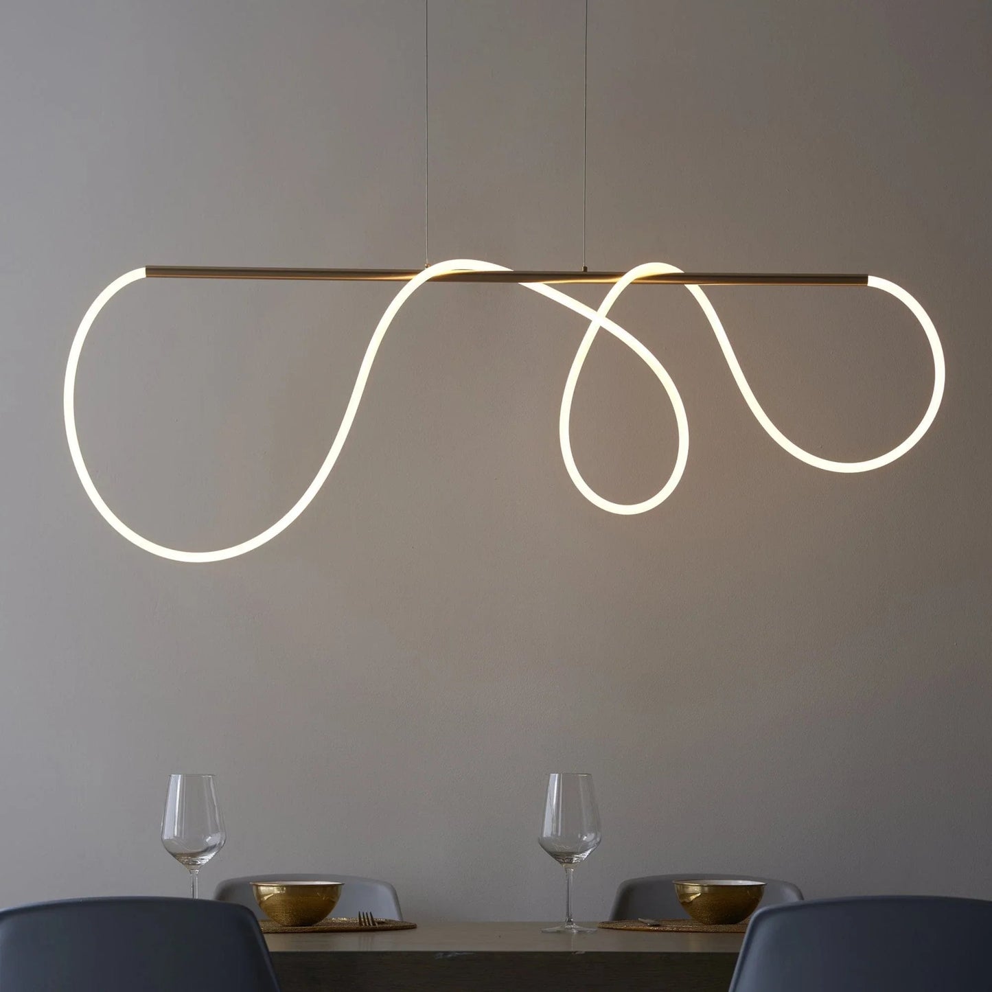 Ambient living room atmosphere with an organic brass pendant light
