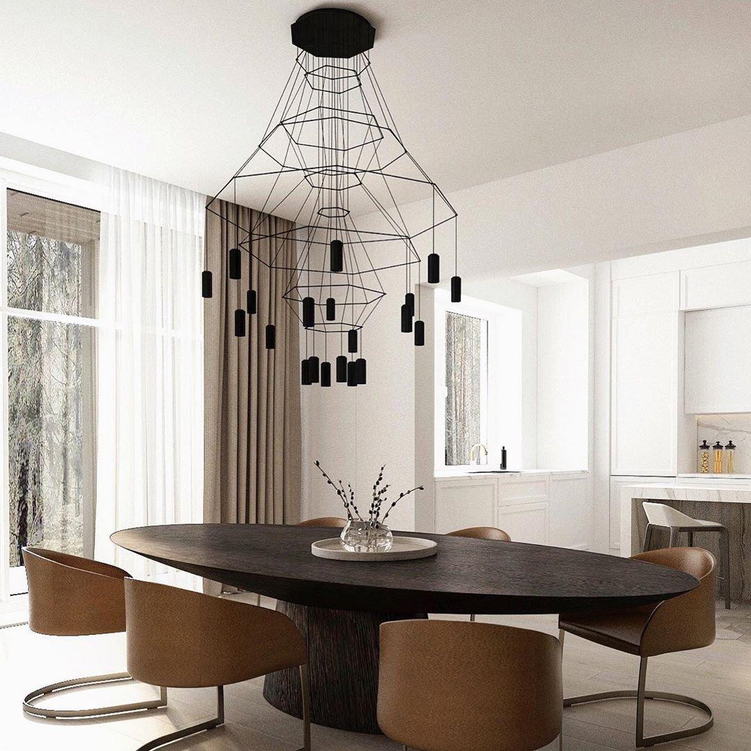 Geometric chandelier creating ambient lighting in a modern living room