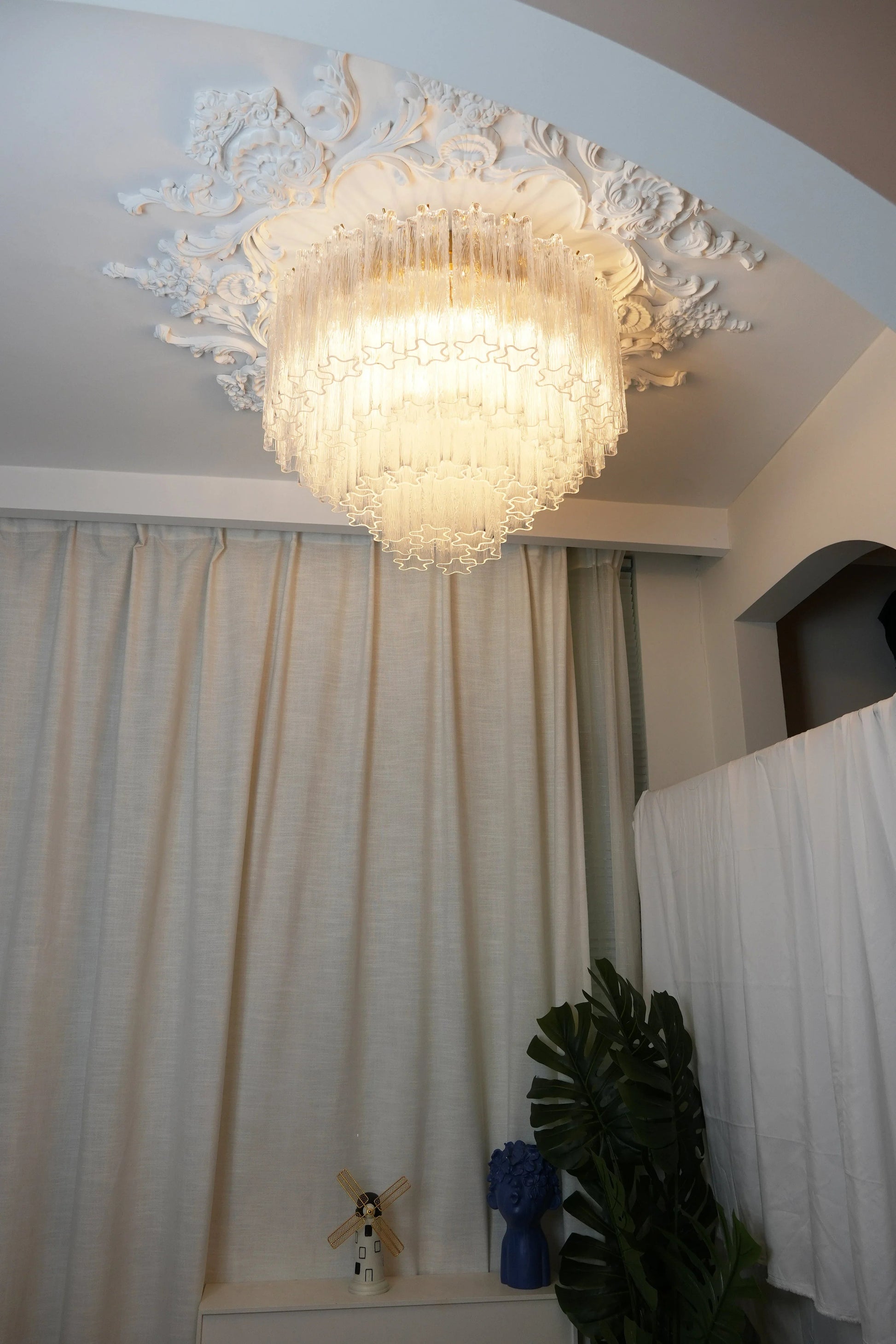 Living room illuminated by elegant textured glass ceiling light