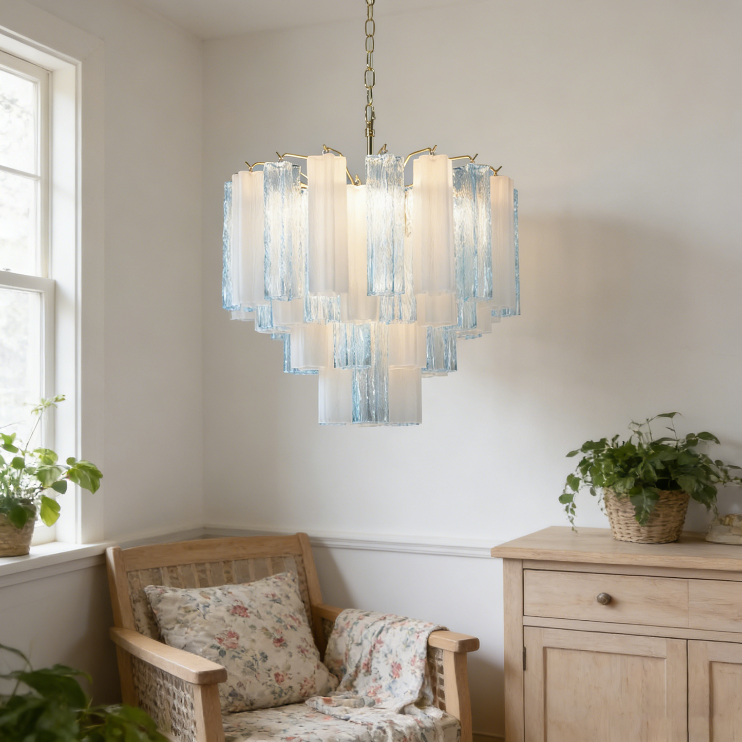 Glass tube chandelier creating a soft, diffused glow in a living room